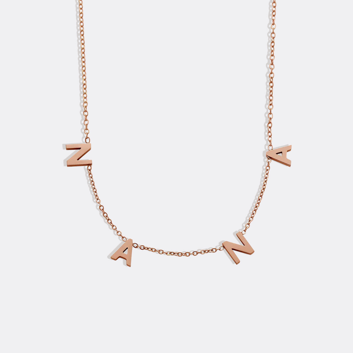 The NANA Letter Necklace in rose gold tone