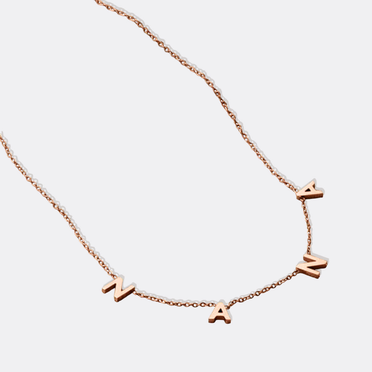 The NANA Letter Necklace in rose gold tone