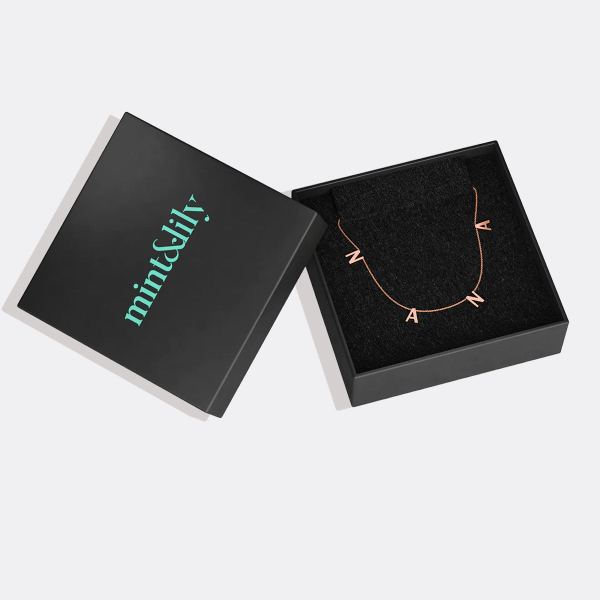 The NANA Letter Necklace in rose gold tone