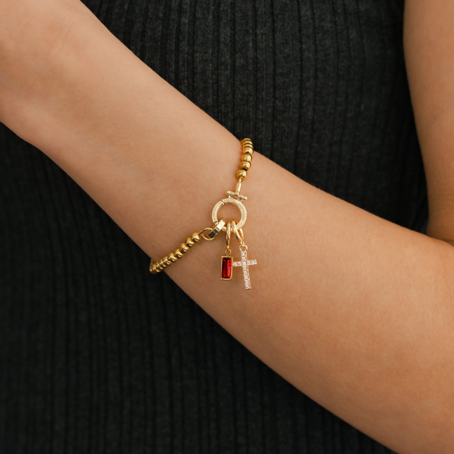 Cross Charm Birthstone Bracelet in gold tone