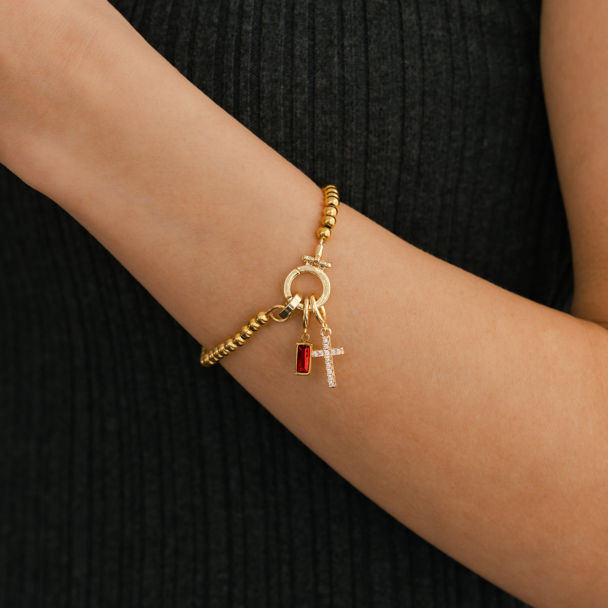 Cross Charm Birthstone Bracelet in gold tone