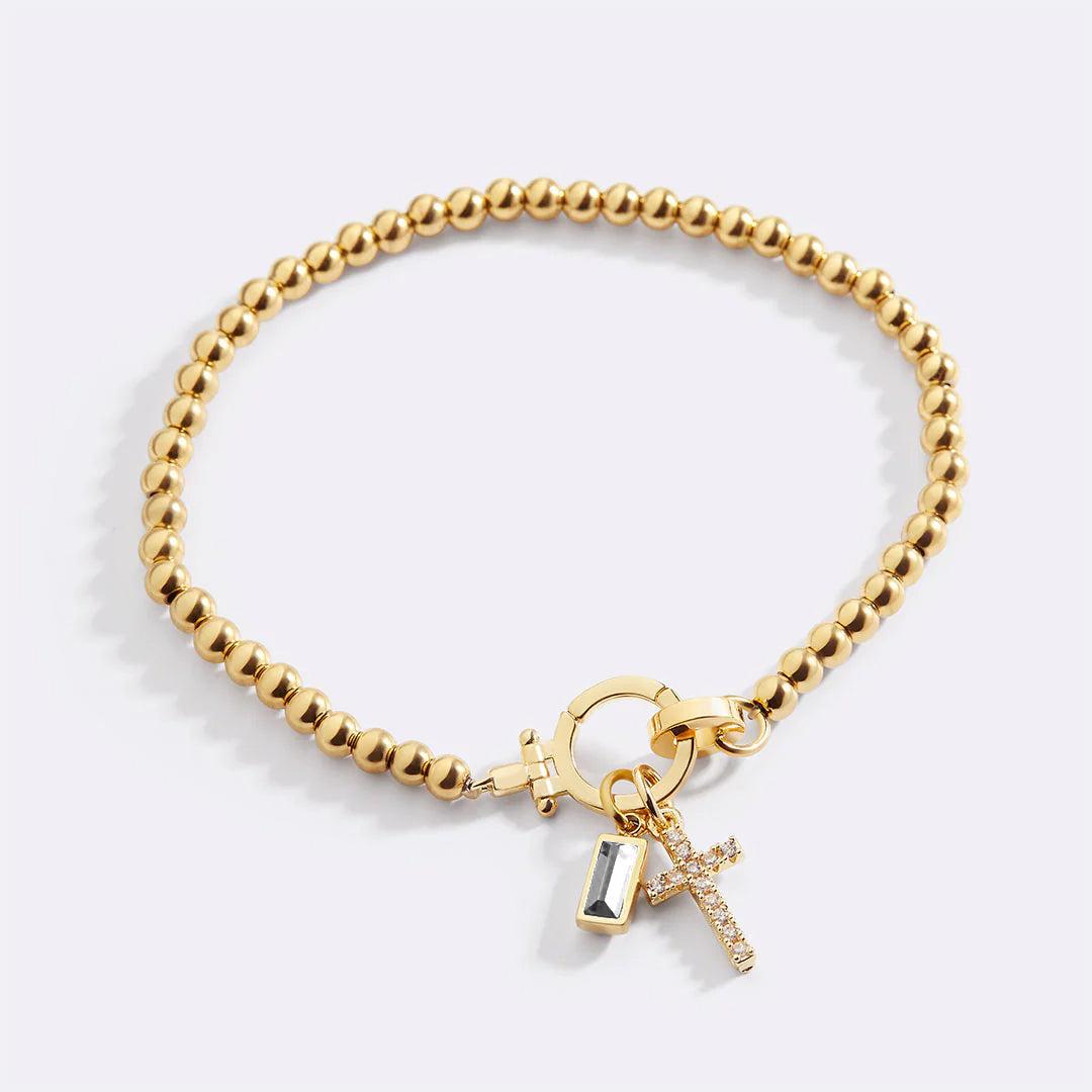 Cross Charm Birthstone Bracelet in gold tone with April birthstone