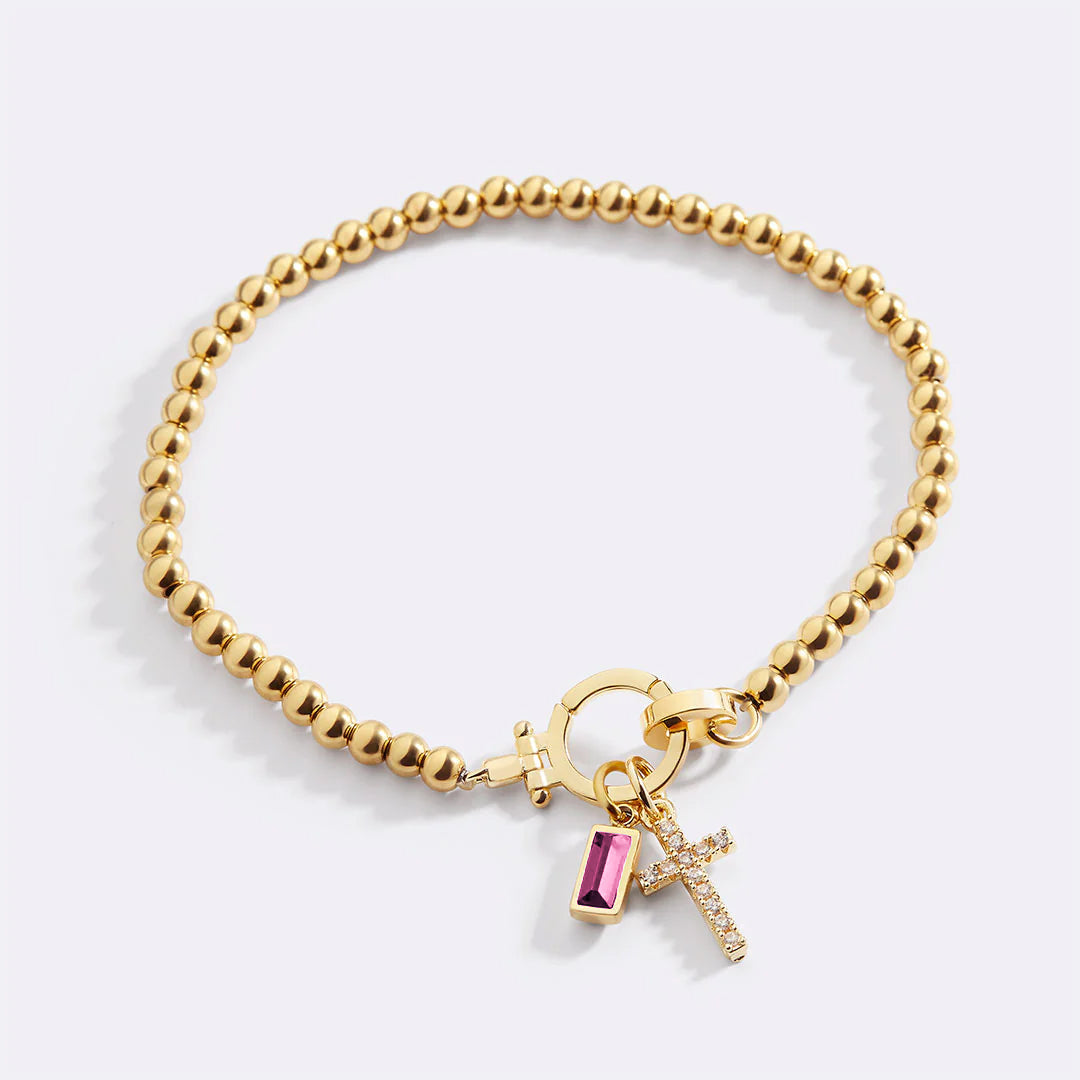Cross Charm Birthstone Bracelet in gold tone with October birthstone