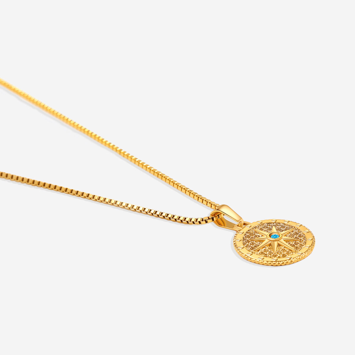Birthstone Compass Pendant Necklace in gold tone with December birthstone