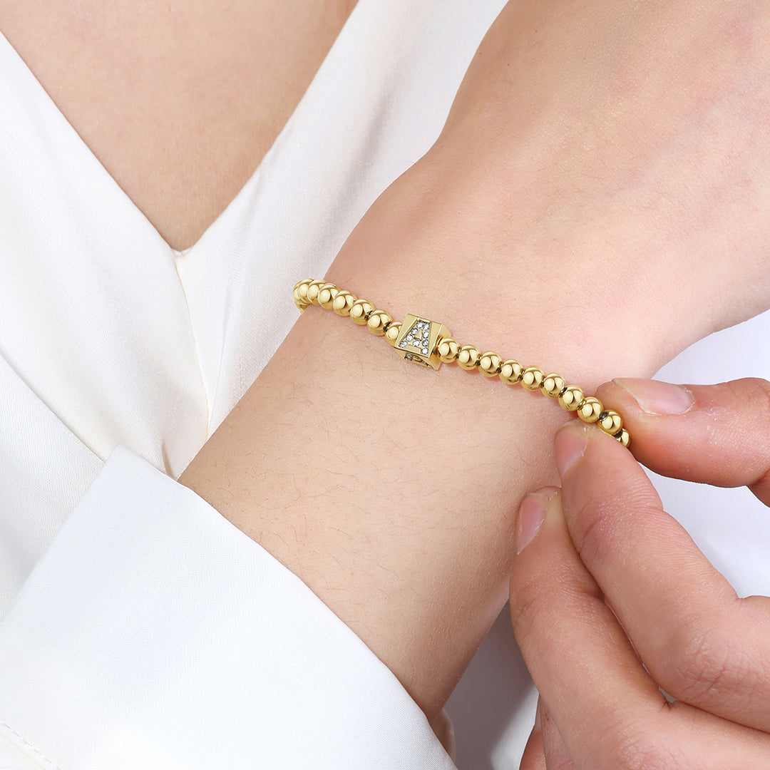 Bracciale con iniziale a blocchi e perline dorate