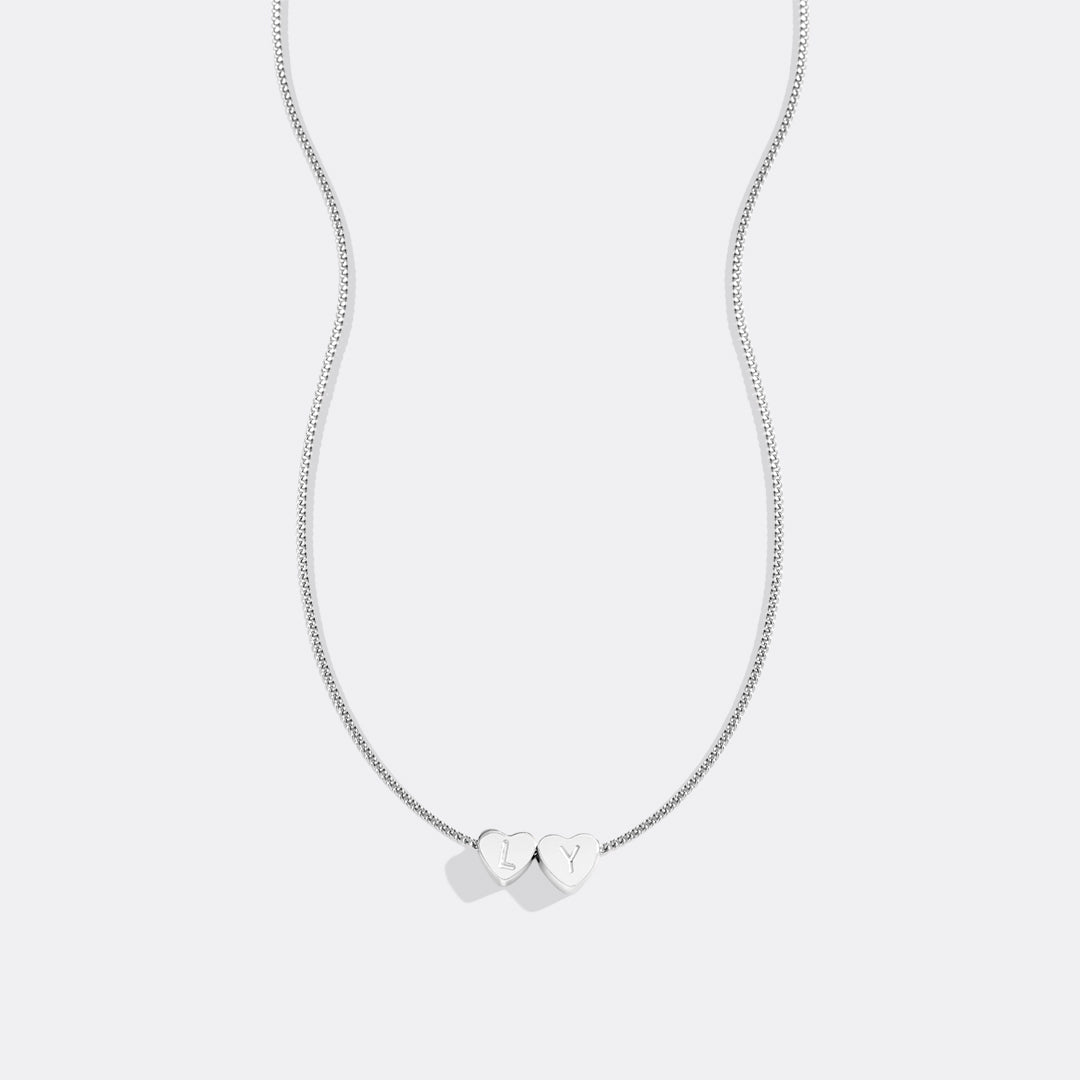 Collana iniziale a cuore impilabile delicata