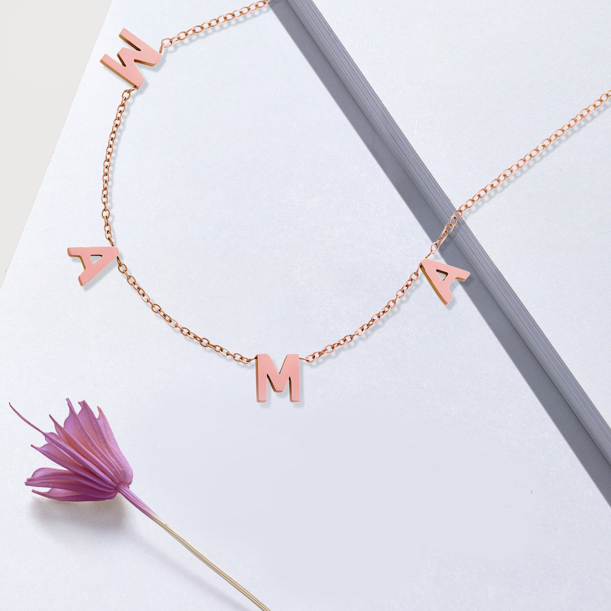 The MAMA Letter Necklace in rose gold tone