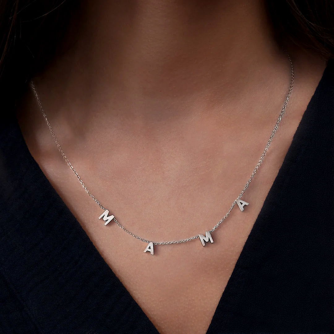 The MAMA Letter Necklace, worn on a model