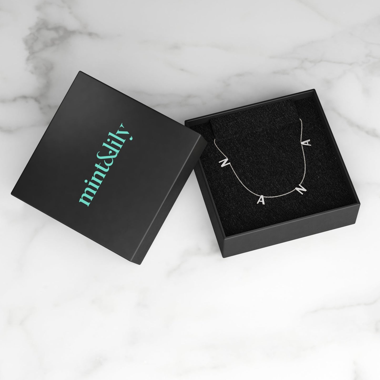 The NANA Letter Necklace in 925 sterling silver, in its gift packaging