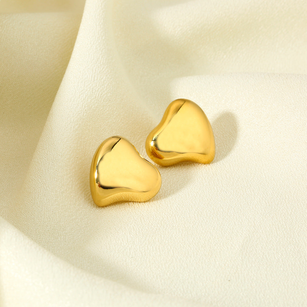 Polished Sculptural Heart Earrings in gold tone