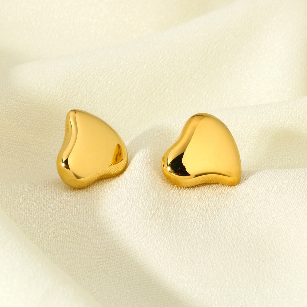 Polished Sculptural Heart Earrings in gold tone